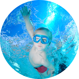 Boy Swimming underwater in pool