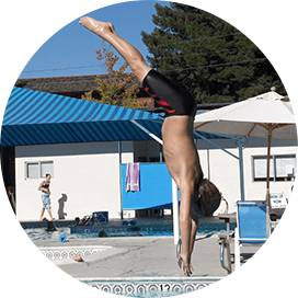 A boy diving into the pool